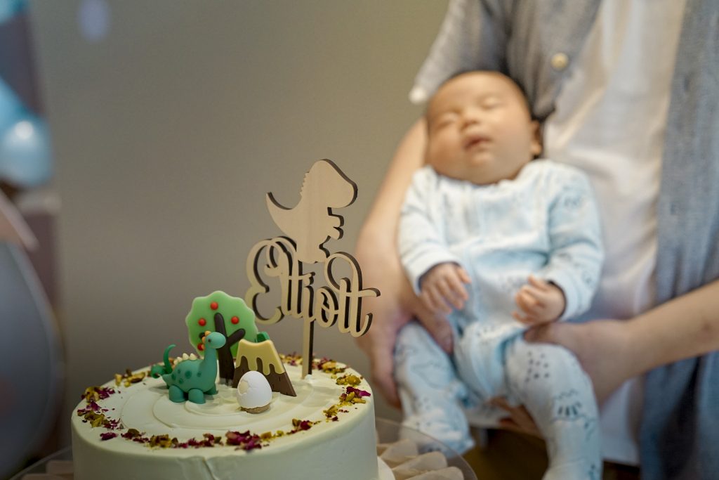 Baby with cake celebrating a baby shower at Nest 1 private event space Singapore
